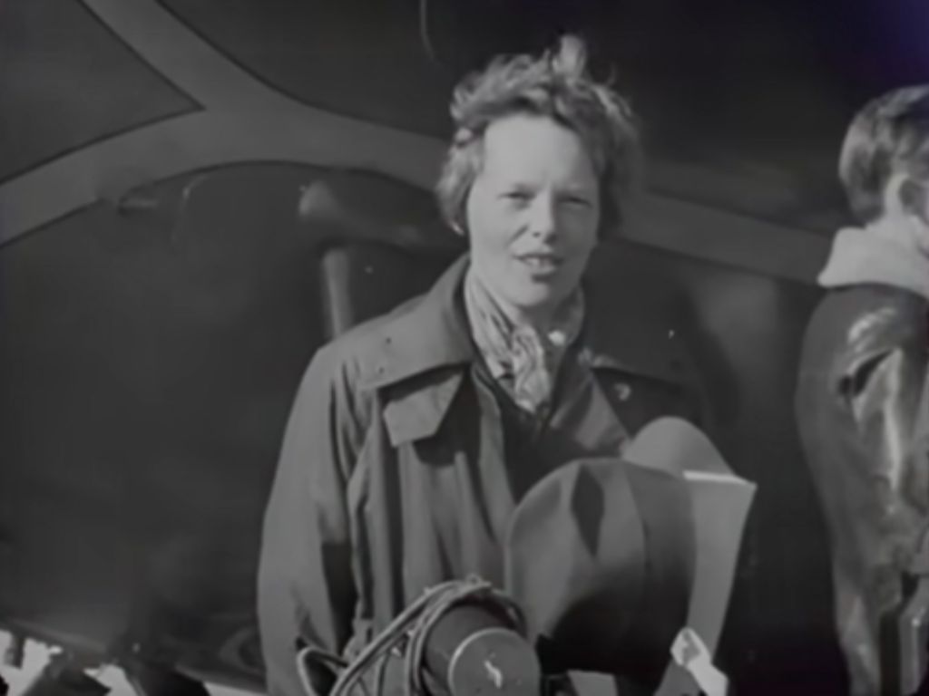 Amelia Earhart speaking to reporters