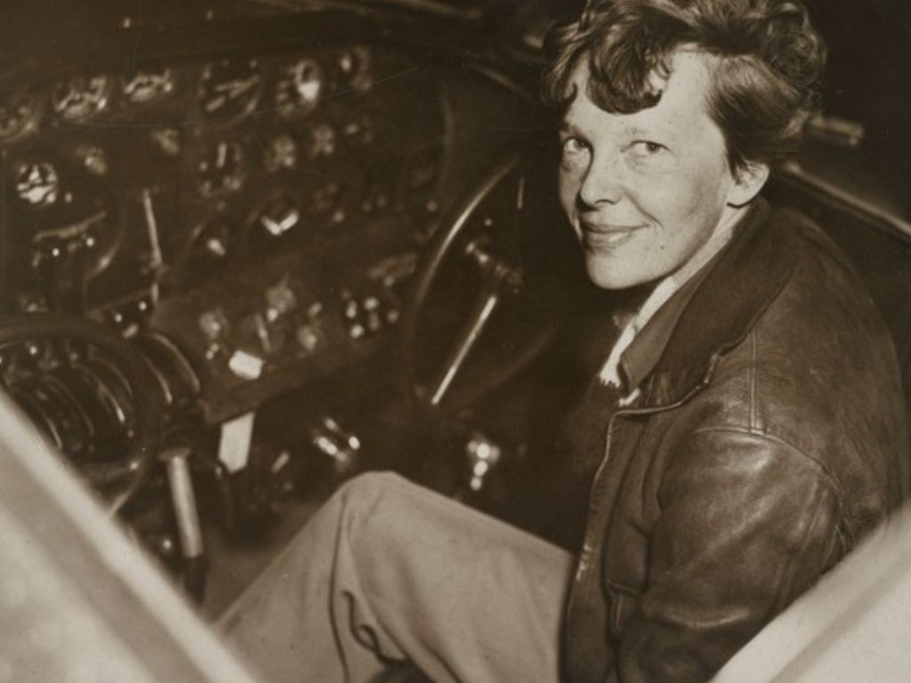 Amelia Earhart in her plane