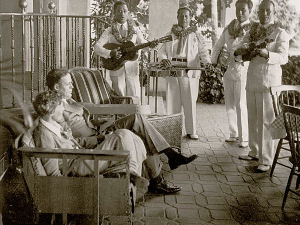 Amelia Earhart and her father being serenaded by a band