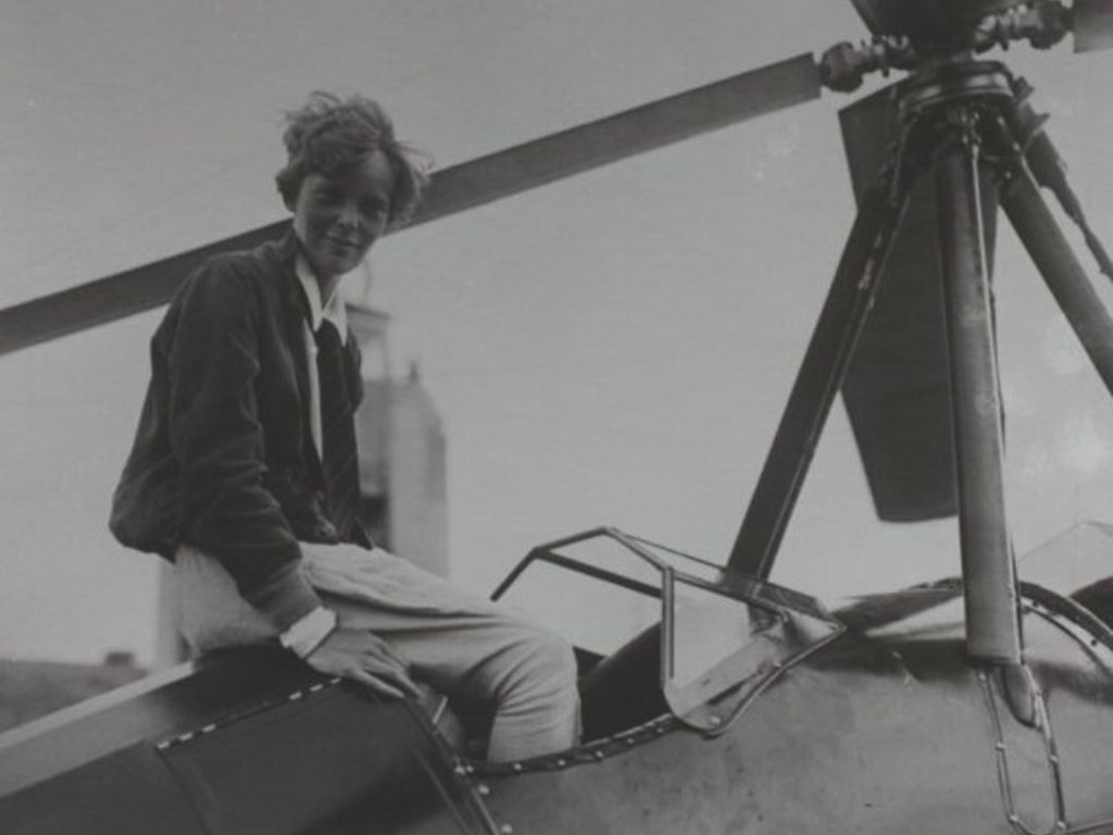 Amelia Earhart in her plane