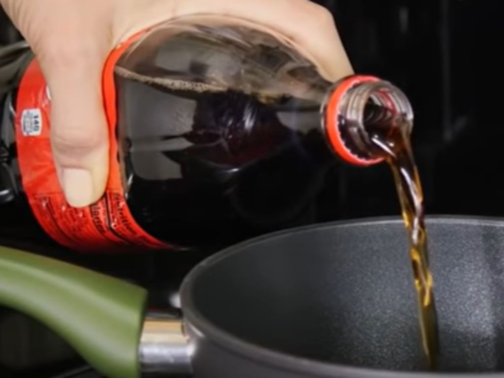 Coca Cola poured into a nonstick pan