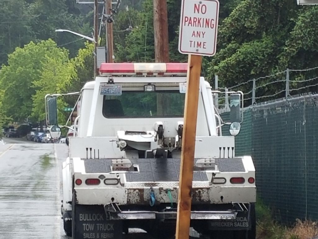 Truck crashing into a "No Parking" sign