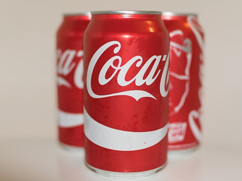 Three cans of Coca Cola