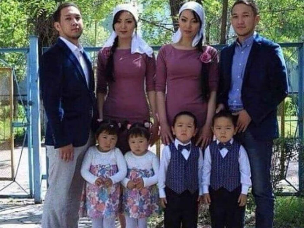 A family that consist of four pairs of twins