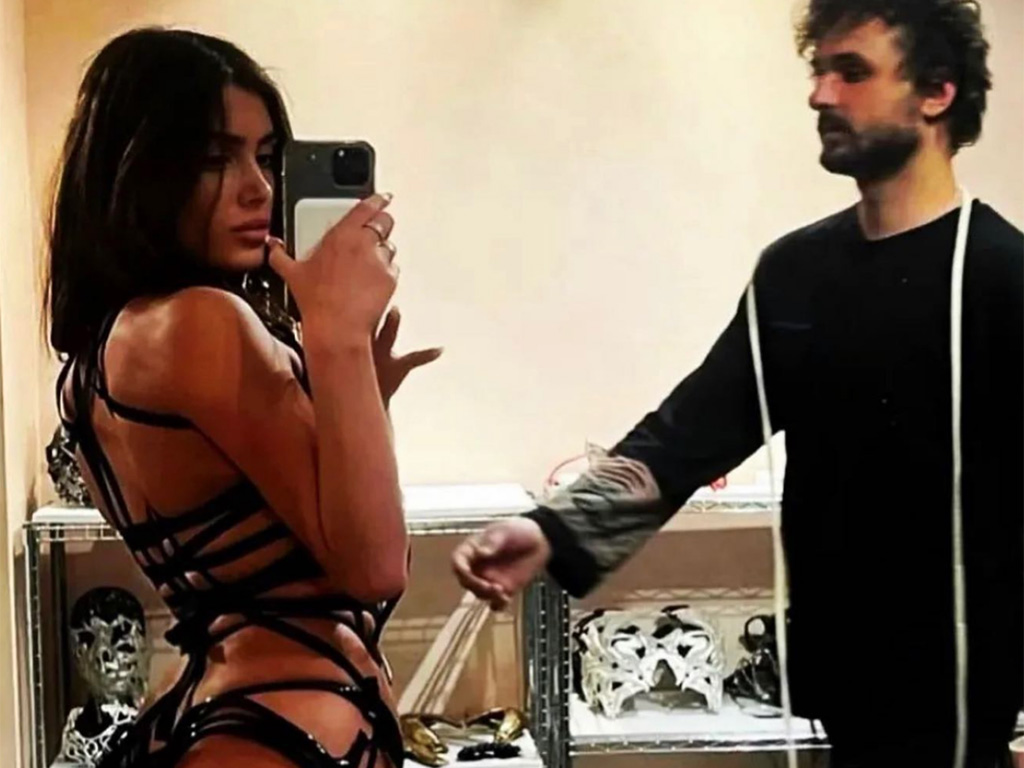 Bianca Censori wearing a risqué outfit in a design studio.