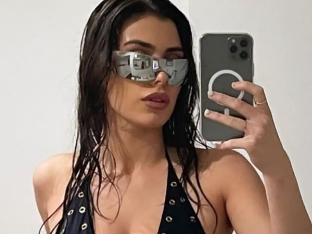 Bianca Censori in a mirror selfie wearing mirrored sunglasses