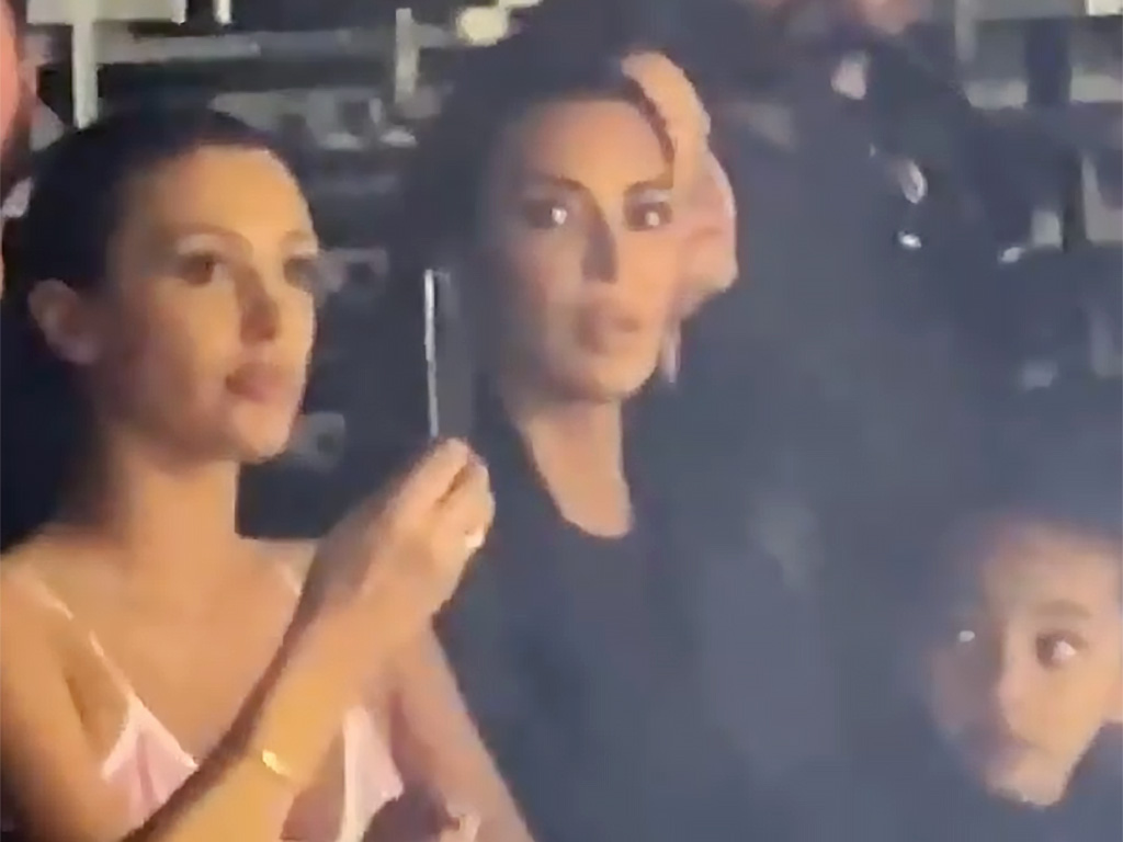 Bianca Censori, Kim Kardashian and one of Kim's children at Ye's album listening party.