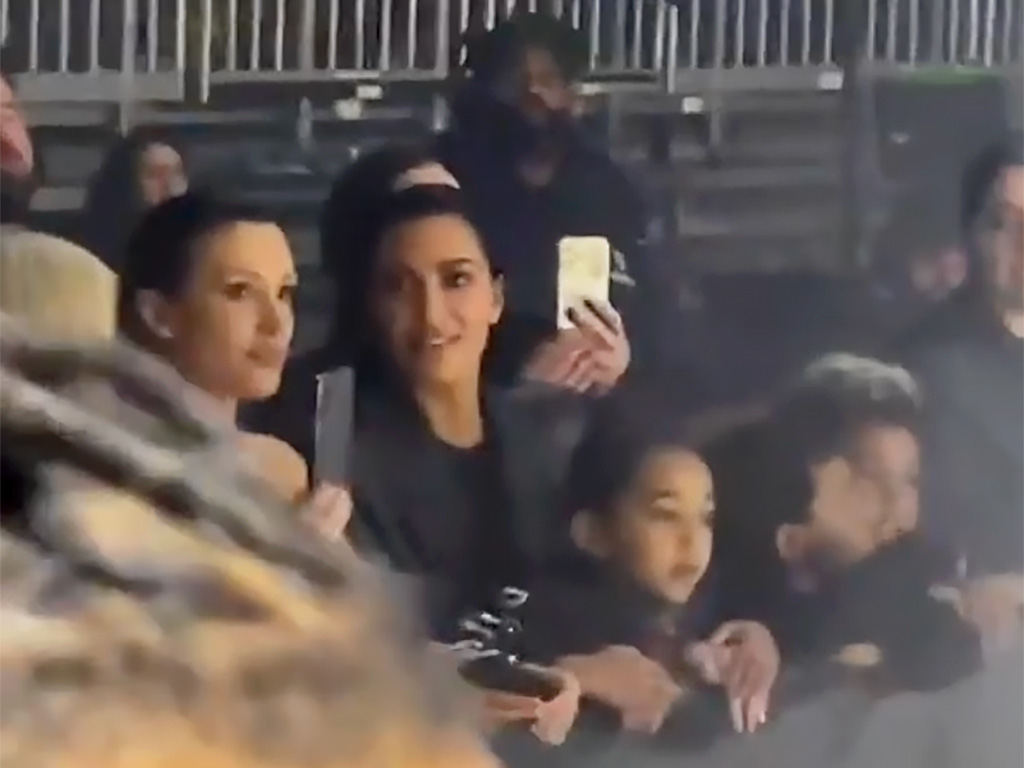 Bianca Censori and Kim Kardashian at Ye's album listening party with two of Kardashian's children