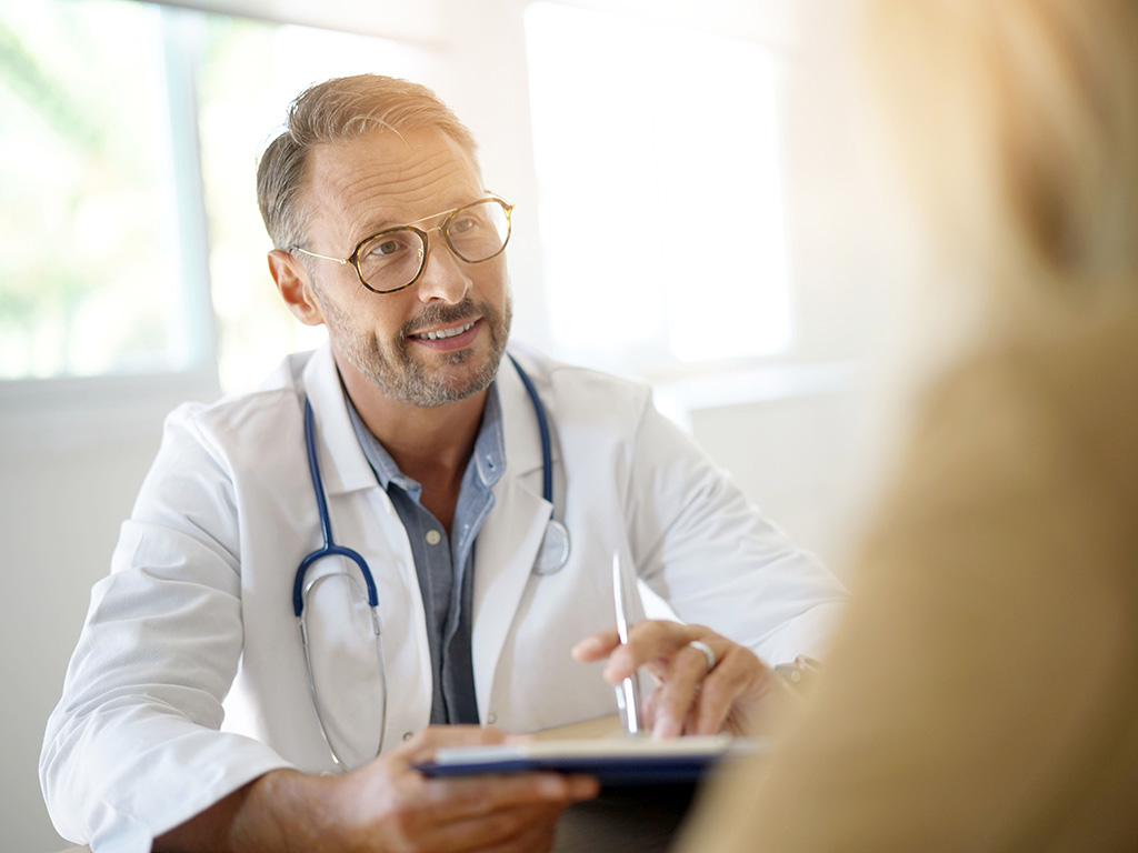 A male doctor talking to a patient