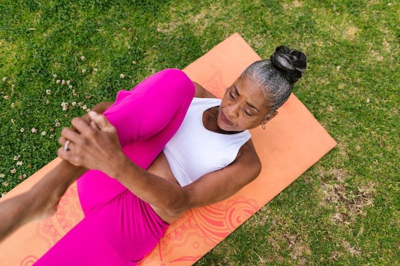 Woman exercising on a yoga mat