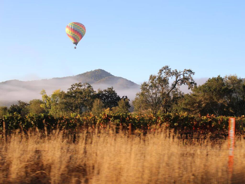 A hot air balloon flying in Napa Valley, California