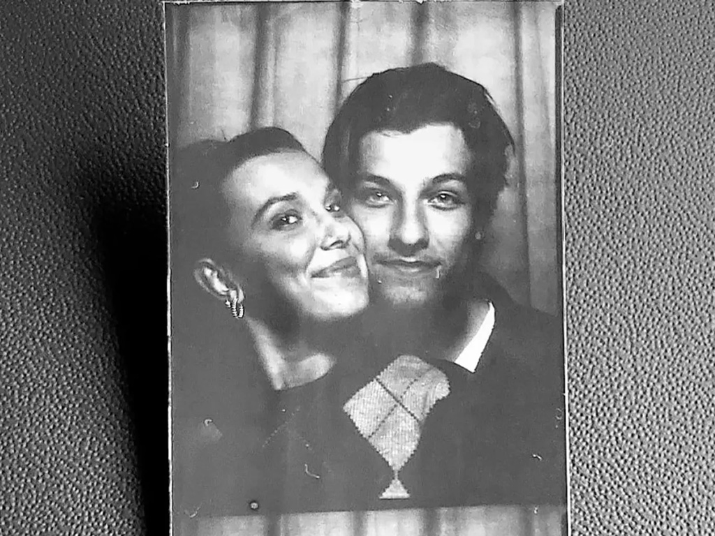 Millie Bobby Brown and Jake Bongiovi black and white photo strip from a photo booth.