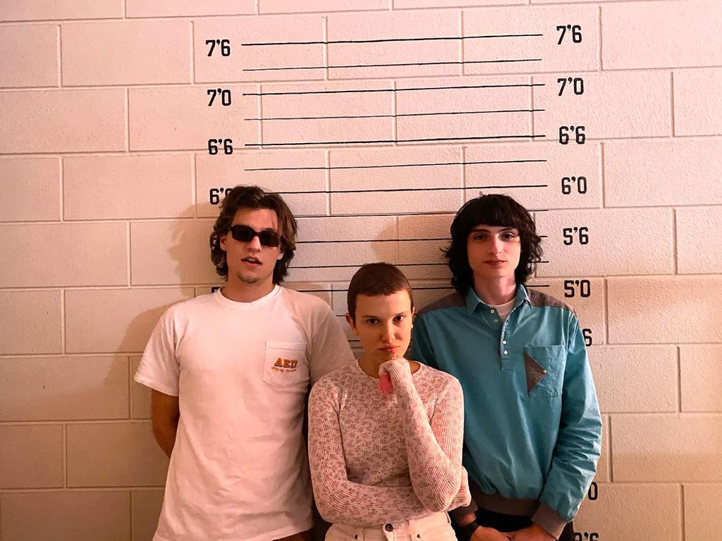 Millie Bobby Brown, Jake Bongiovi and Noah Schnapp on the set of "Stranger Things"