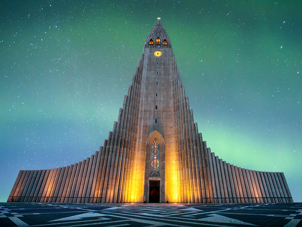 Hallgrímskirkja is a Lutheran (Church of Iceland) church in Reykjavík.It is the largest church in Iceland and the tallest structures in Iceland.There is an colorful aurora borealis in baackground