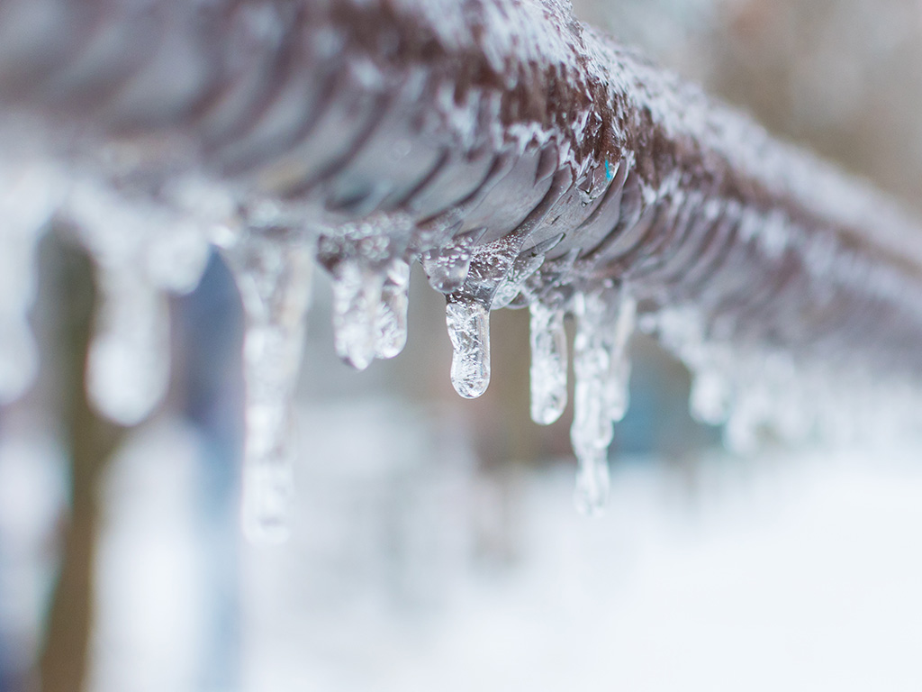 Ice frozen onto pipes