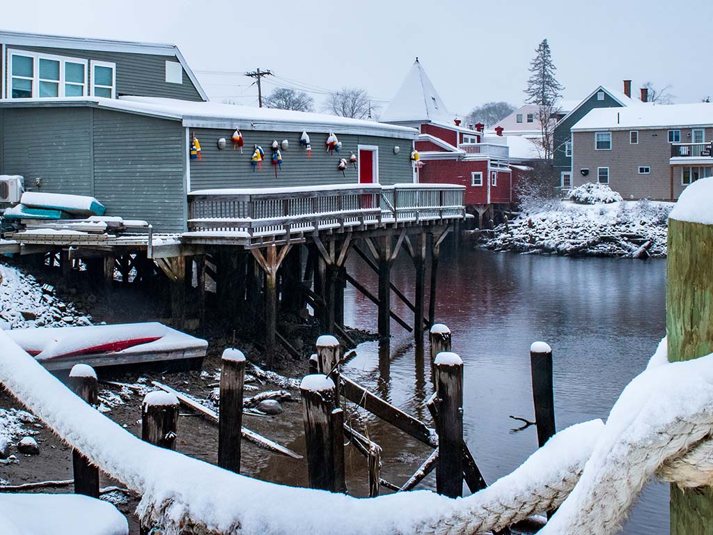 Home pier in Kennebunkport Harbor, Maine during a snowstorm