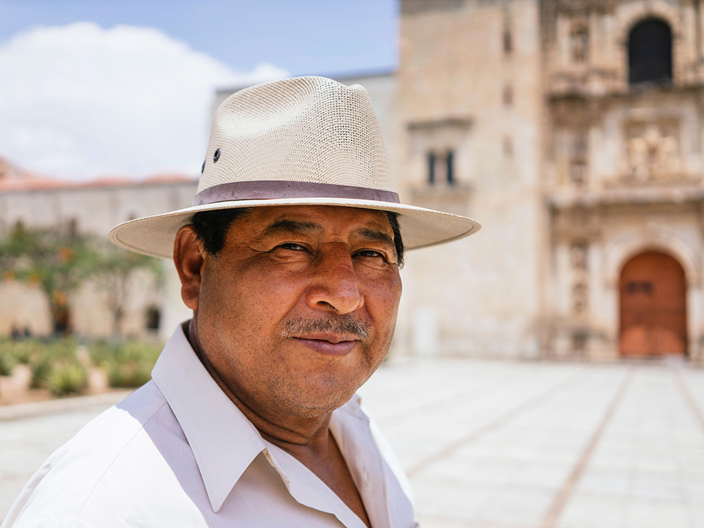 Mexican grandfather smiling at camera