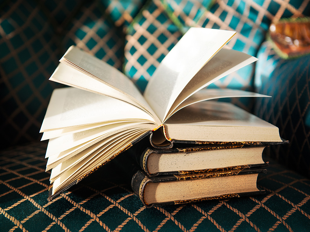 Vintage old books on the antique chair