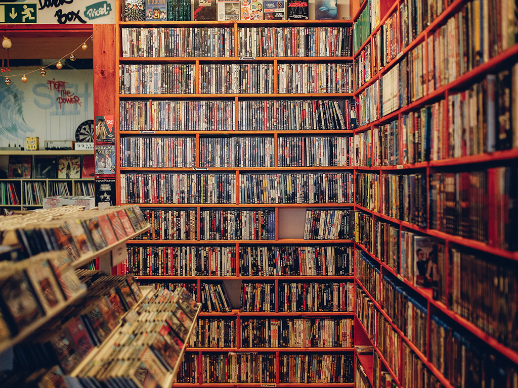 A library with a shelf of DVDs