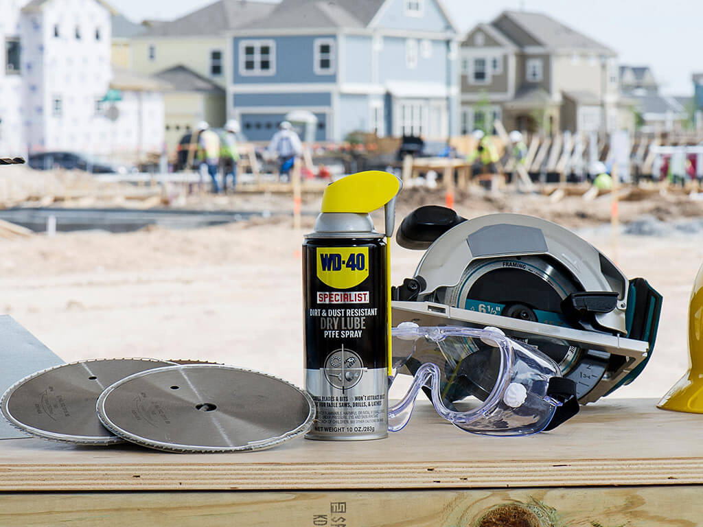 A can of WD-40 next to power tools