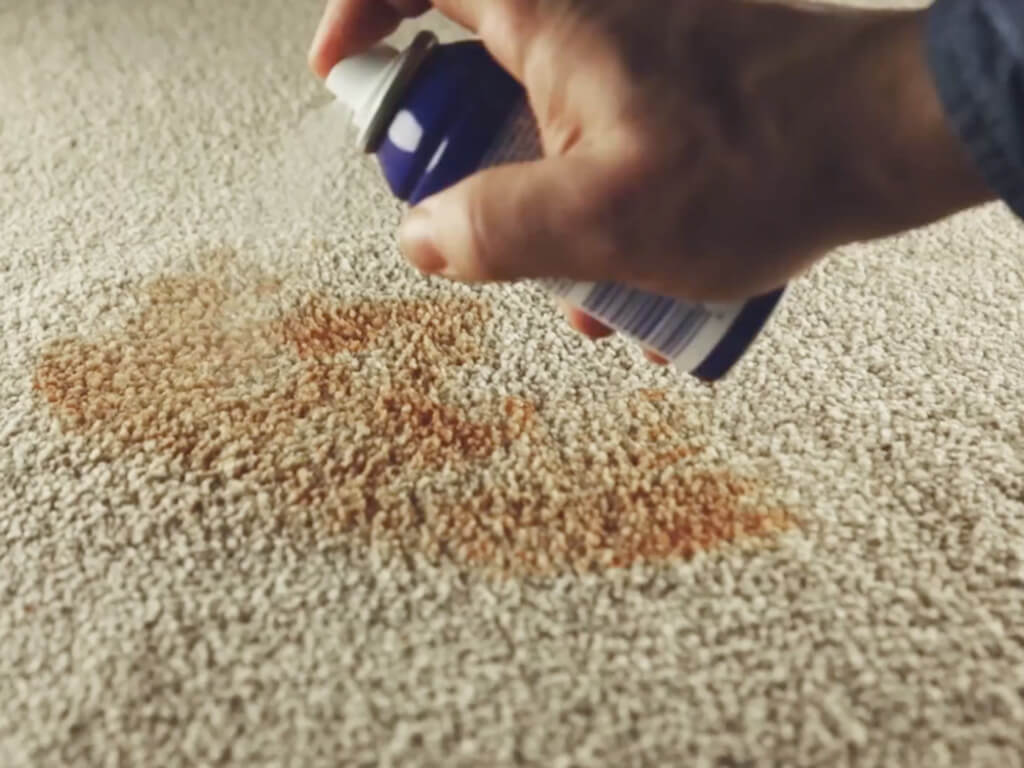 Cleaning a carpet stain with WD-40