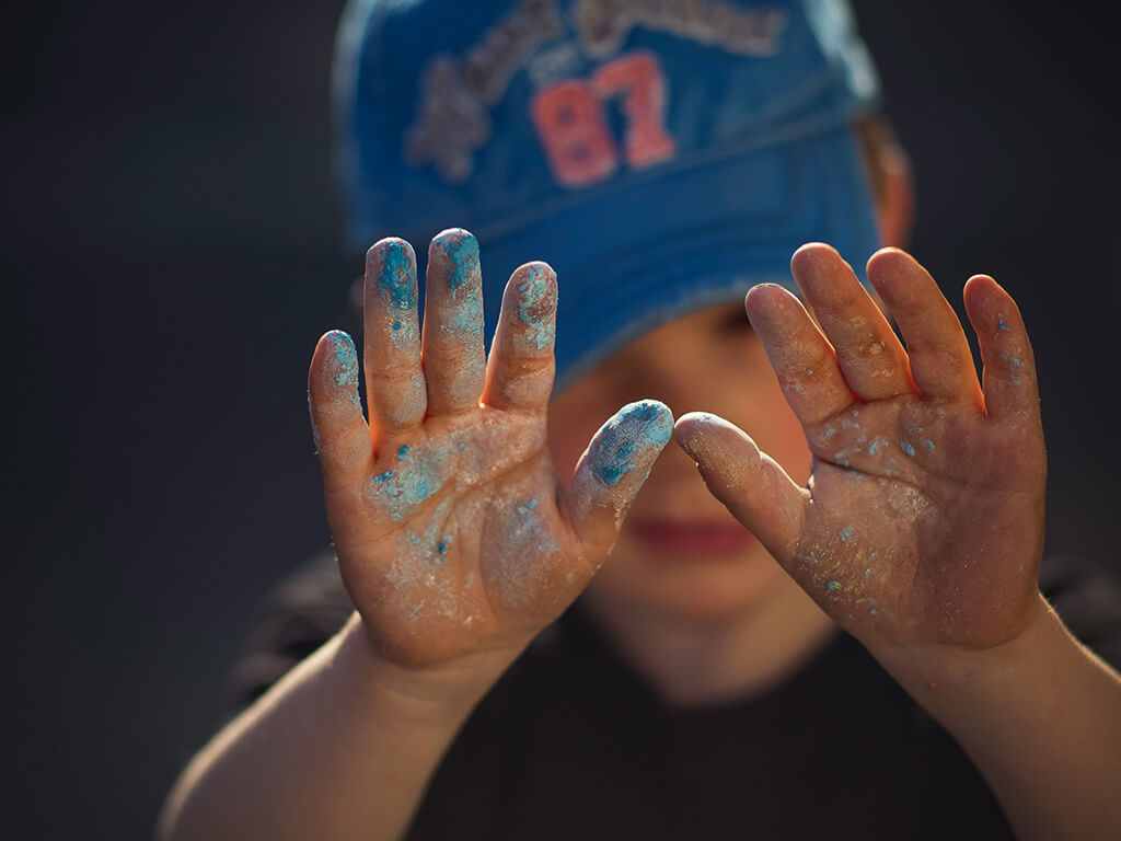 Child with paint on their hands