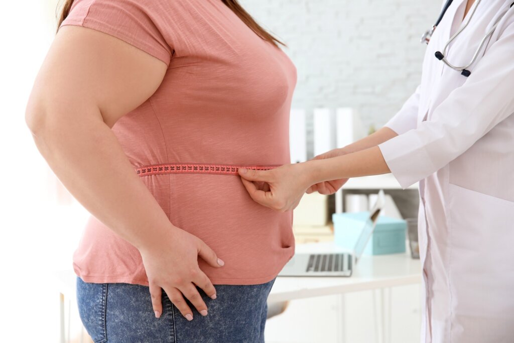 Person being measured by a doctor