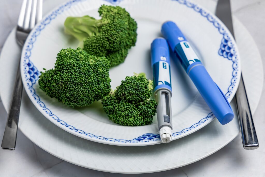 Plate of broccoli and medicine