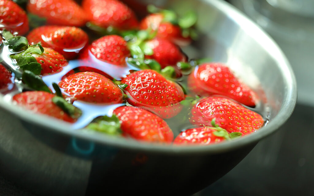 Strawberries floating in water