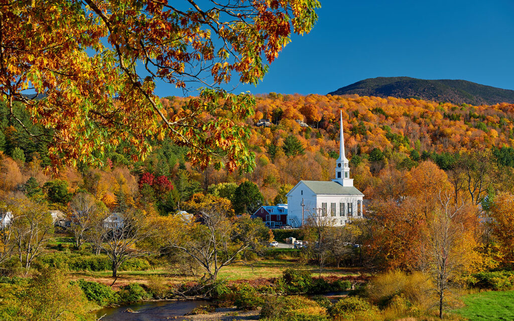 Iconic New England church in Stowe town at autumn in Vermont, USA