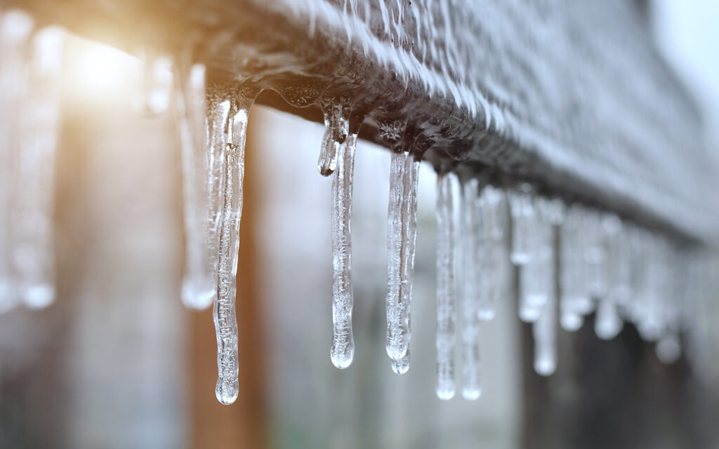 Close-up of icicles after a winter ice storm. Effect of atmospheric icing.