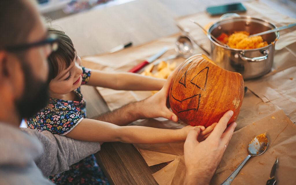 Family carving pumpkins together