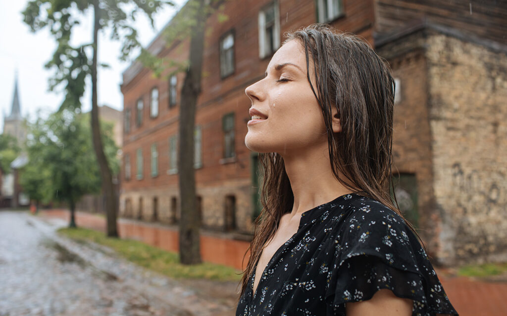 Woman standing in the rain