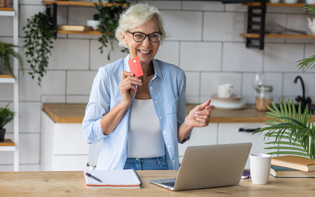 Elderly woman shopping online