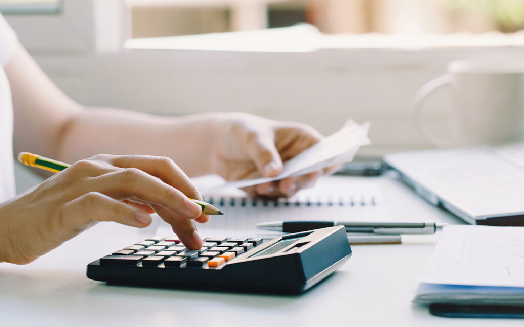 Person doing math on a calculator